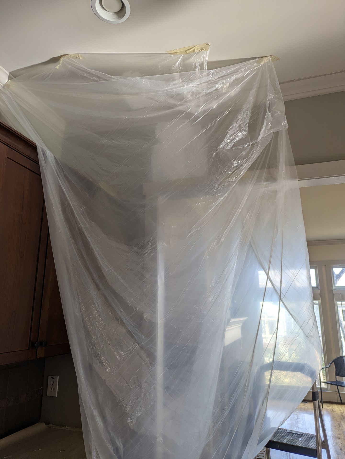 Zip-wall dust containment system installed in an Athens kitchen